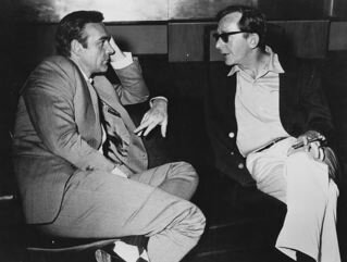 Connery confers with director. Connery confers with director.